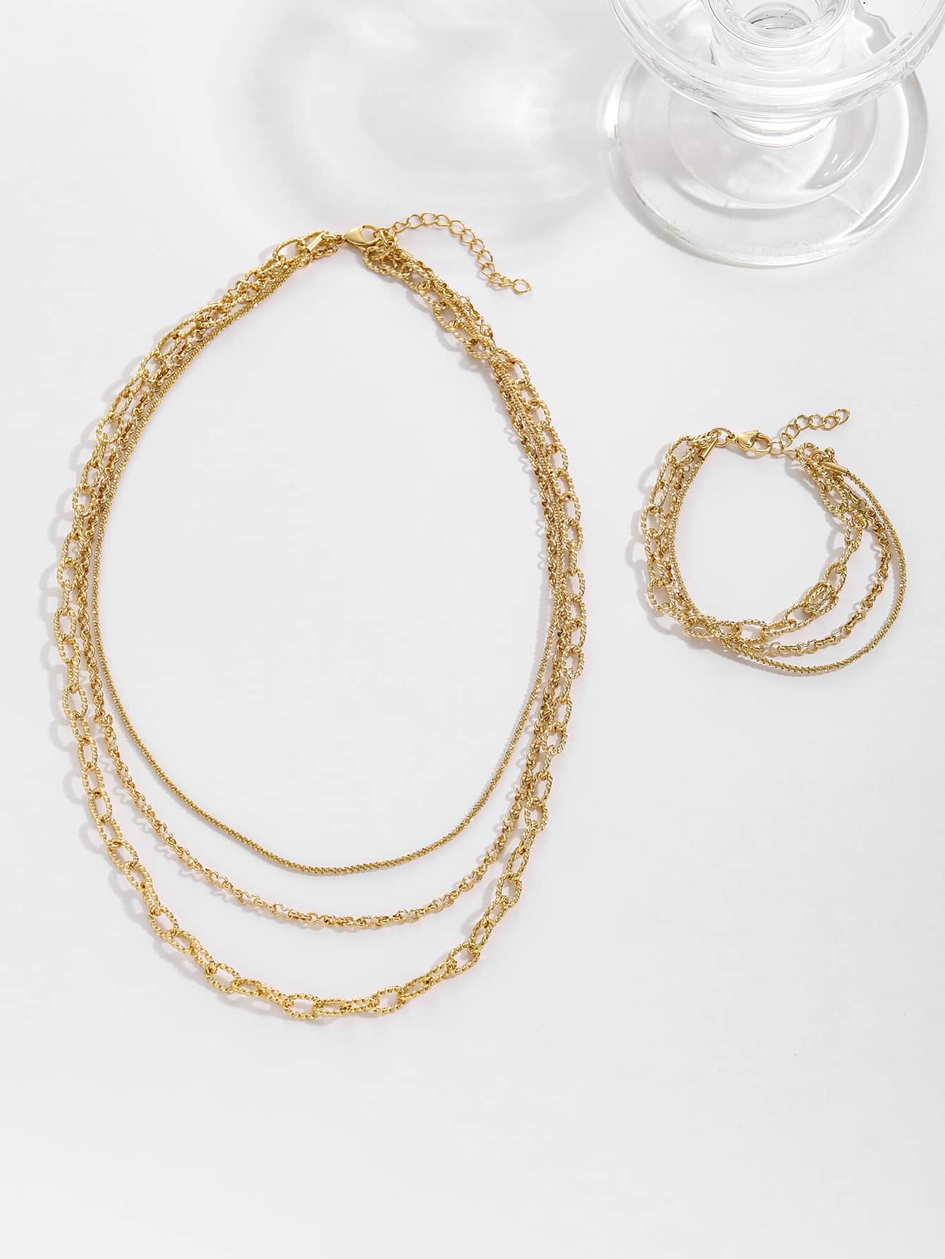 Elegant smyckeset med glöd i tre lager